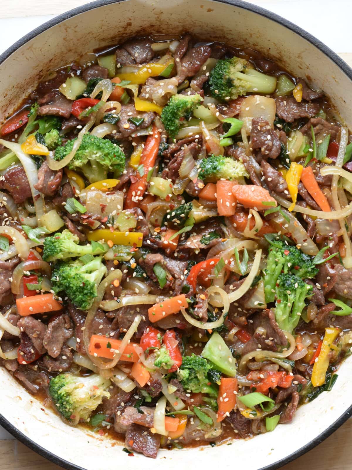 Thin sliced steak stir fry with broccoli and sesame seeds. 