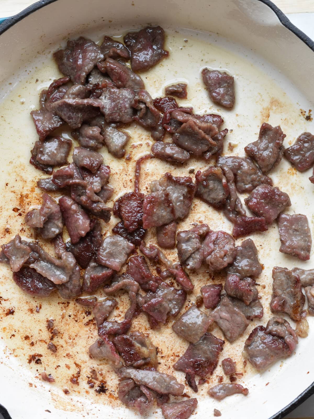 Browning thin sliced steak. 
