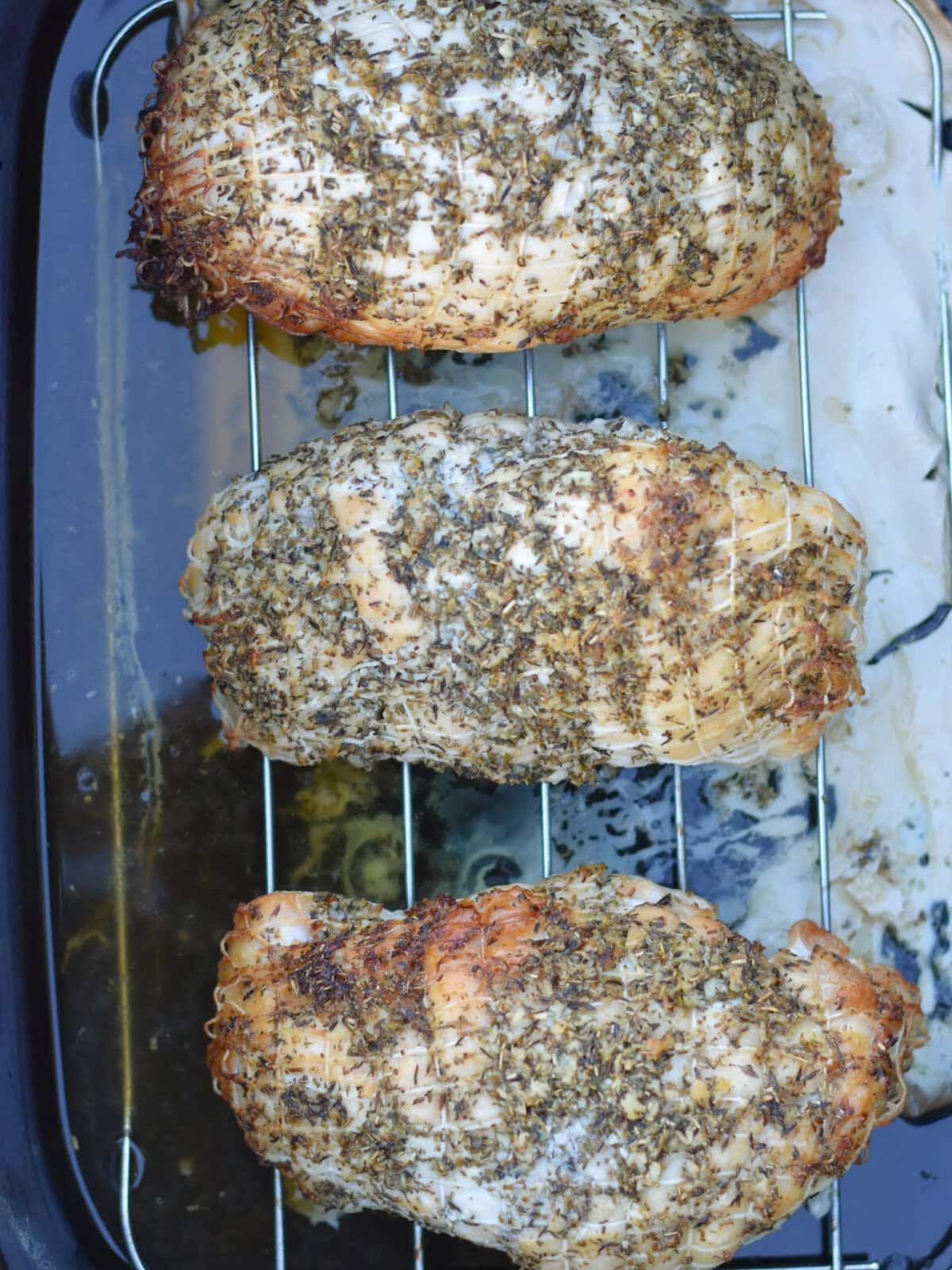 Three roasts on a rack. 