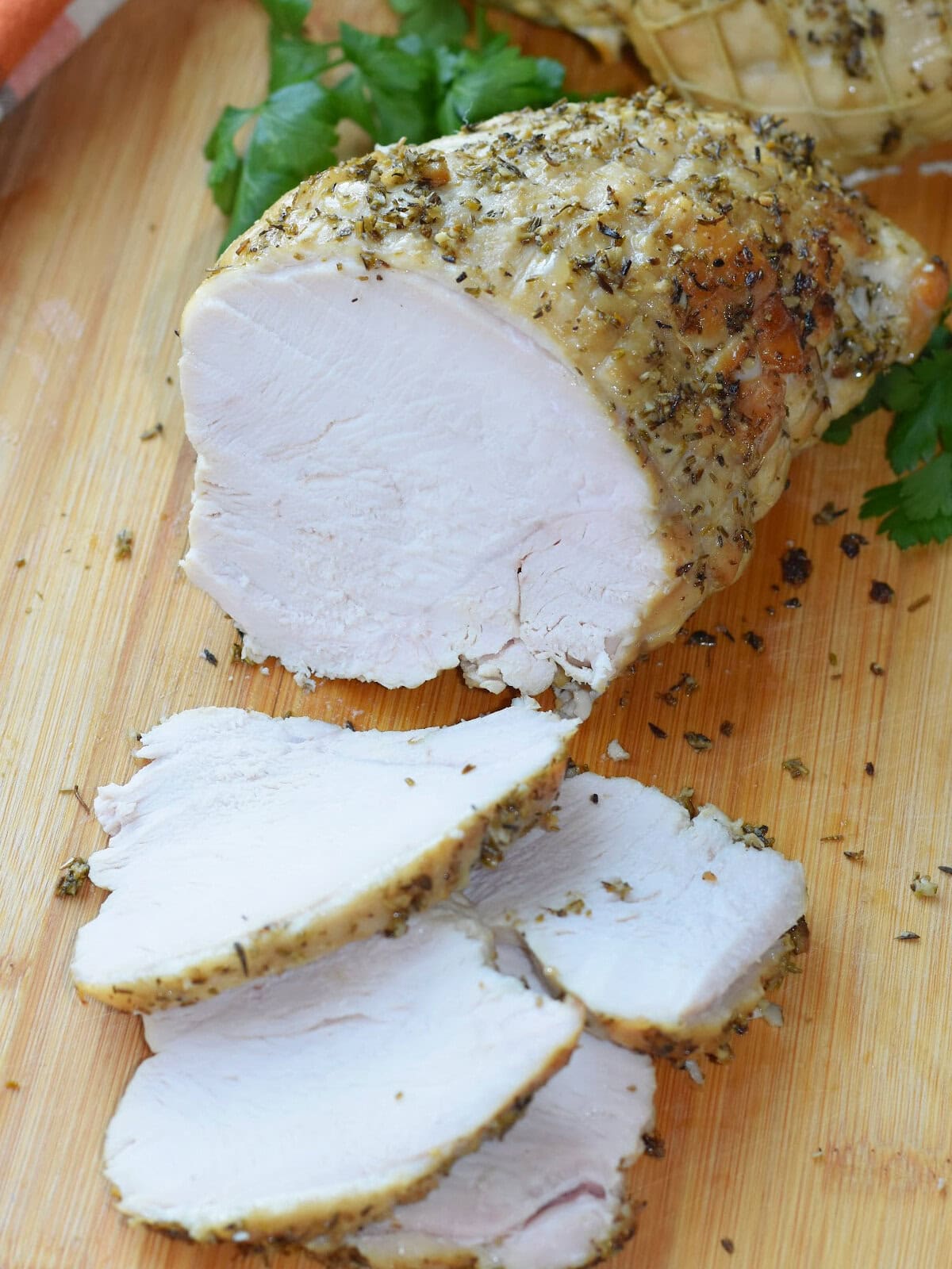 Sliced boneless turkey breast made in a electric roaster oven.
