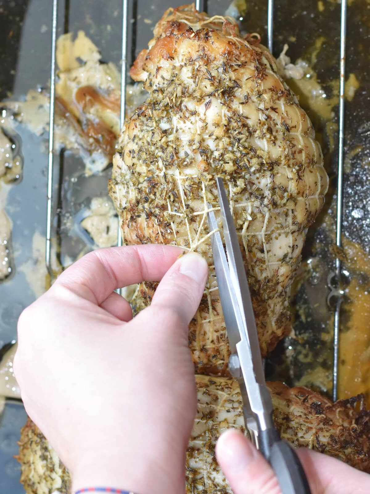 Cutting the netting for roast serving. 