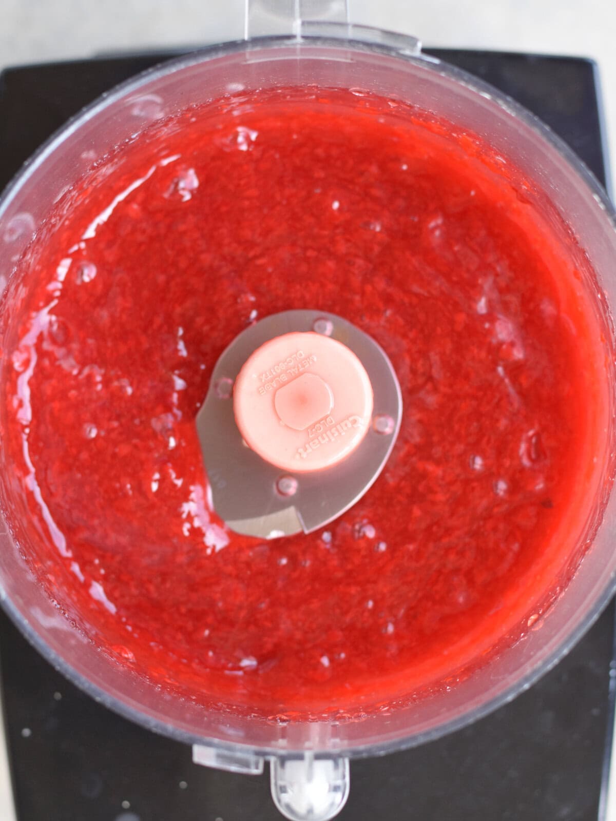 Minced cherries in a food processor. 