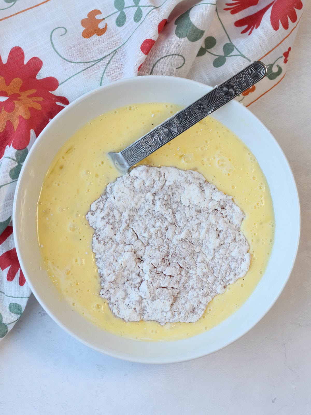 Egg dredge for the floured and tenderized meat. 