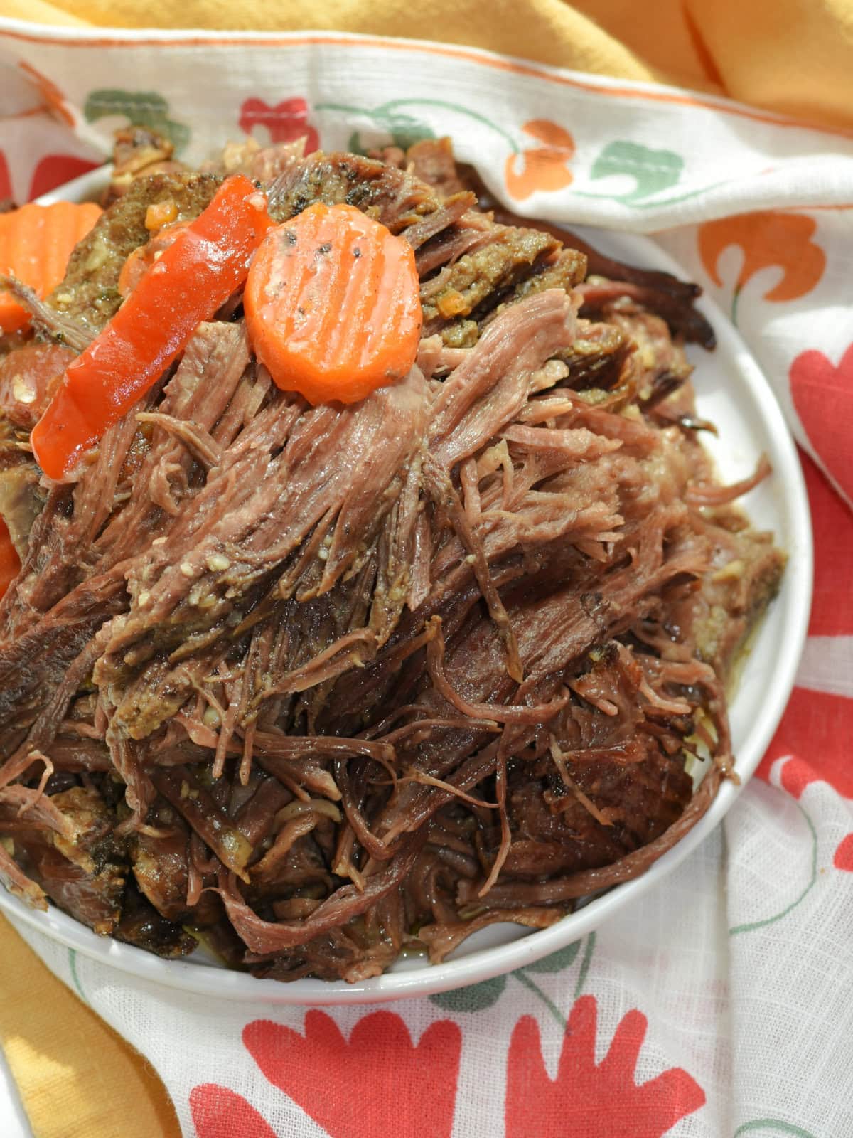 A bowl of shredded pulled beef. 