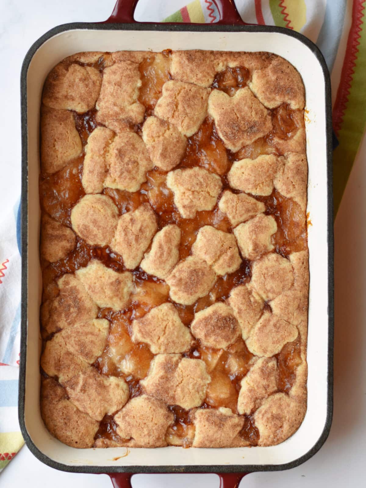 Cooked cookie dough cake with apple pie filling. 