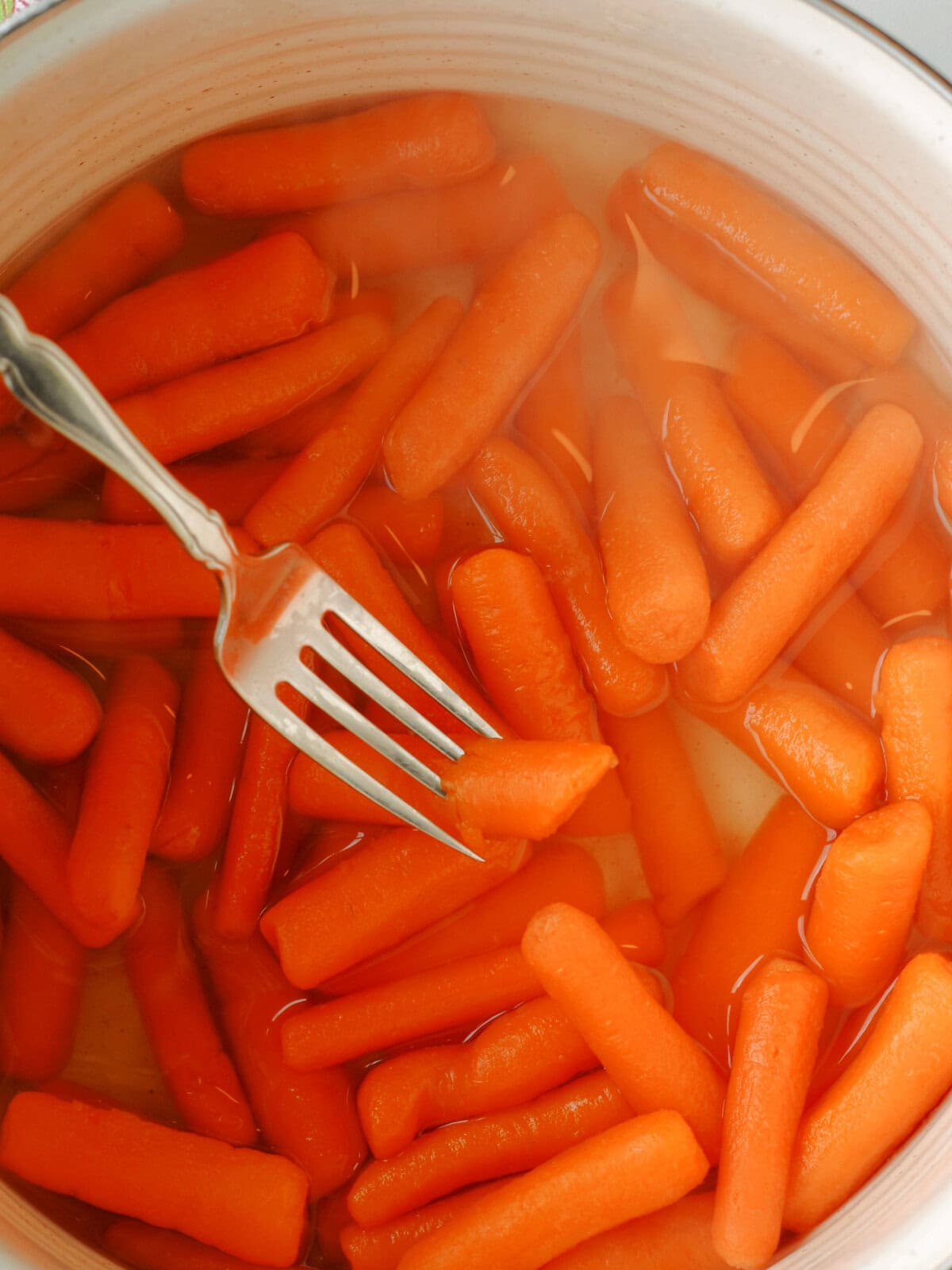 glazed-carrots-marmalade-tender Fork tender vegetables that are finished cooking.