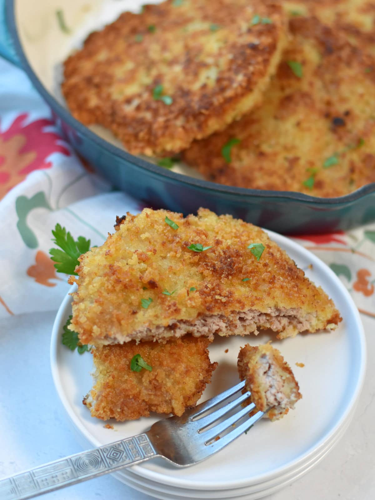 Cubed Pork Steak with panko bread crumb crust on a white plate. 