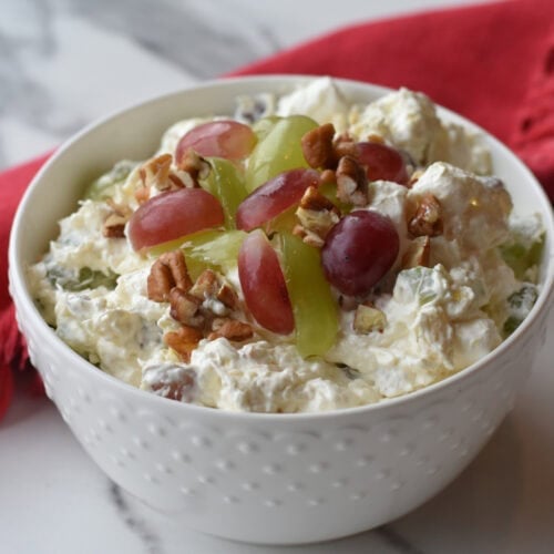 Christmas Fruit Salad with fluffy marshmallows, celery, grapes, cream cheese and pecans.