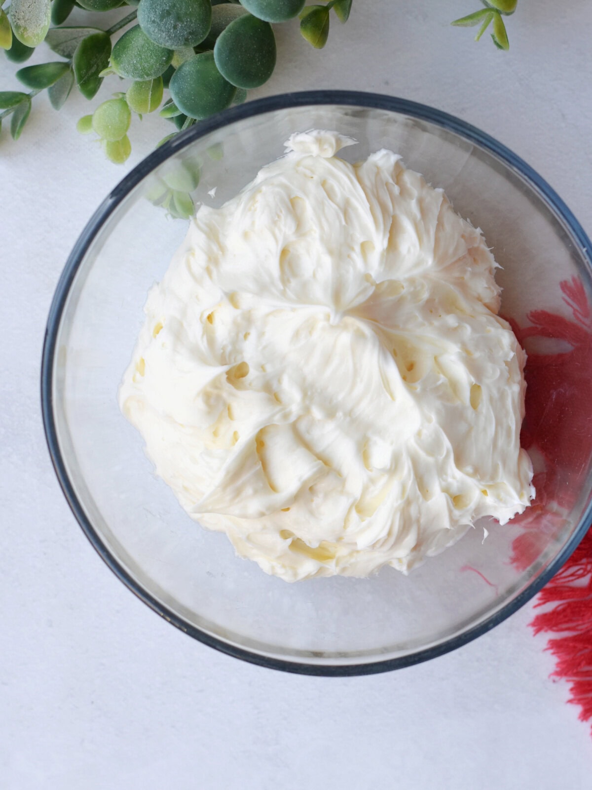 Softened cream cheese, powdered sugar and vanilla mixed in a bowl. 