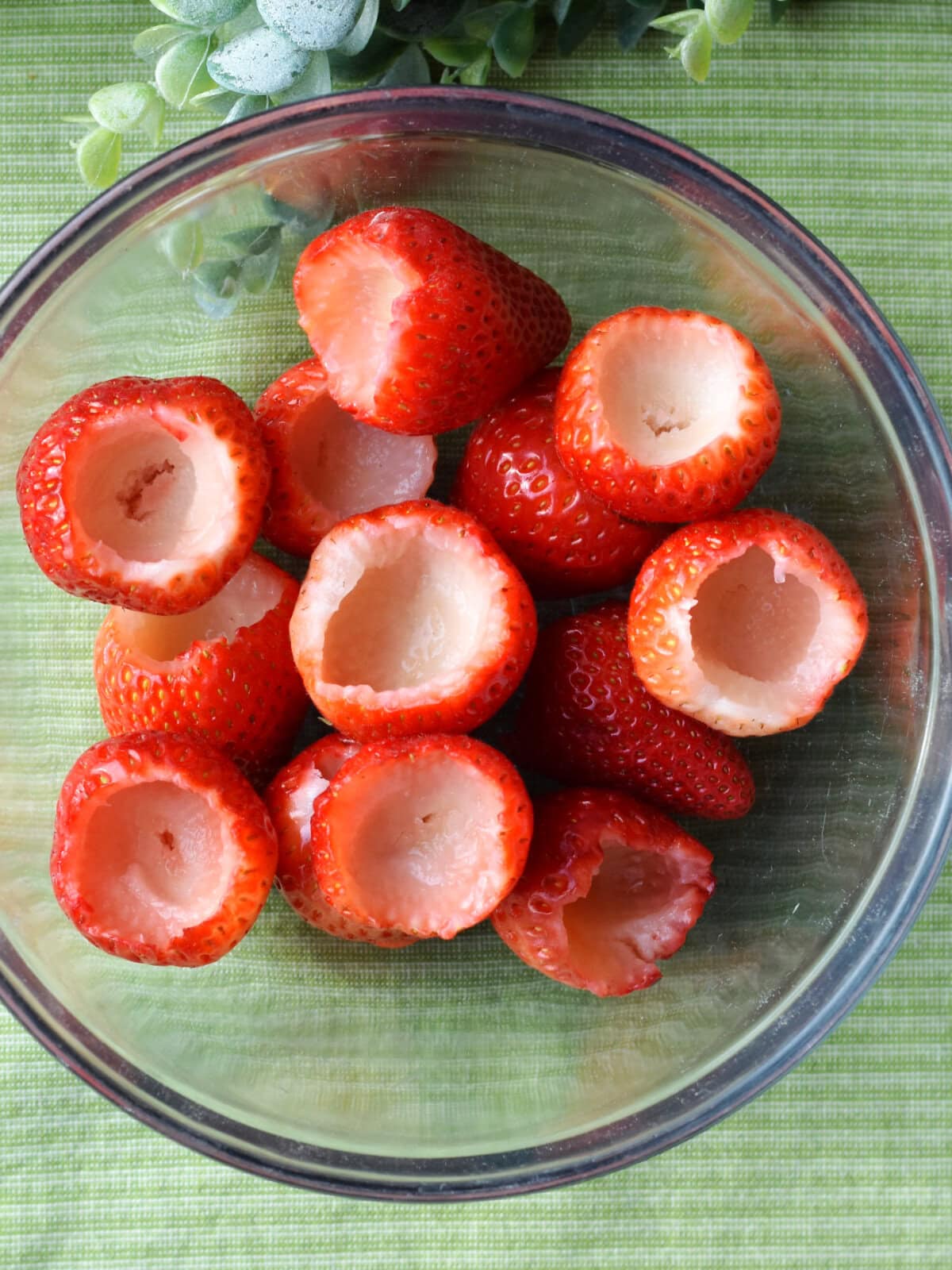 Preparing to place filling in the strawberries. 