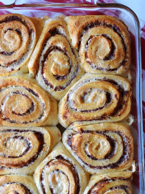Cooked cinnamon rolls in a serving dish. 