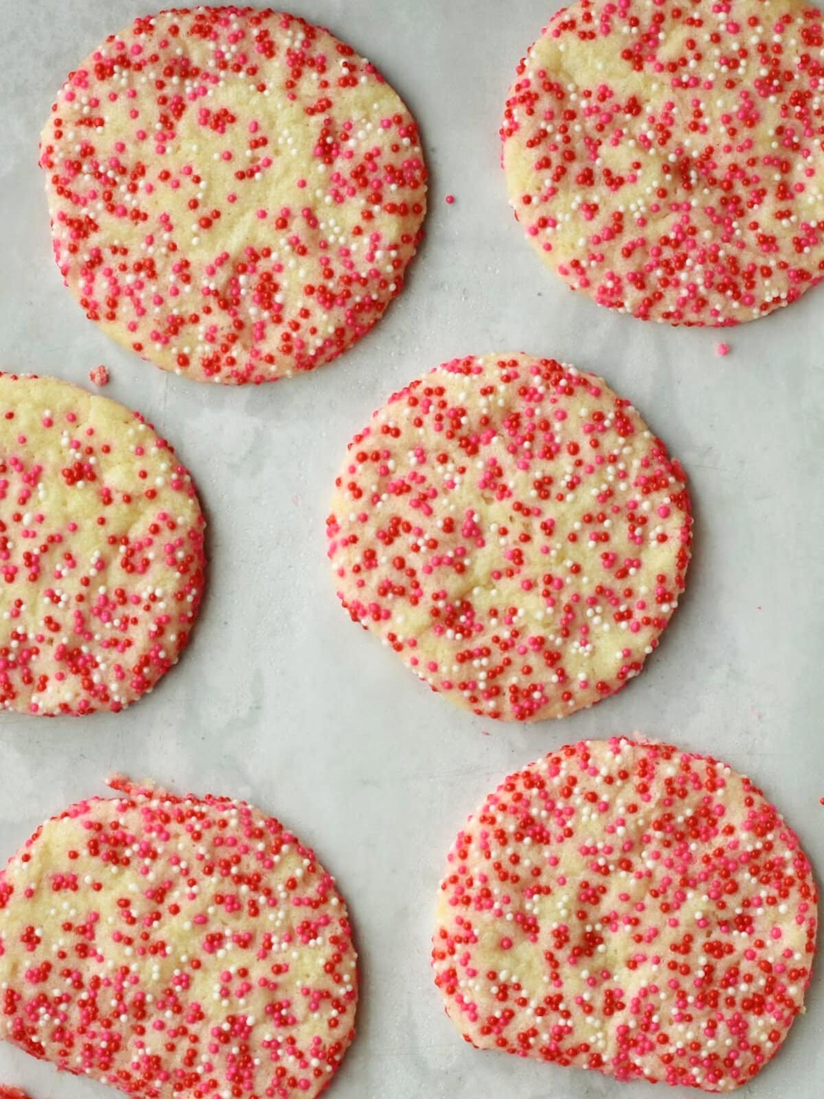 Baked dough with sprinkles in a flat round shape. 