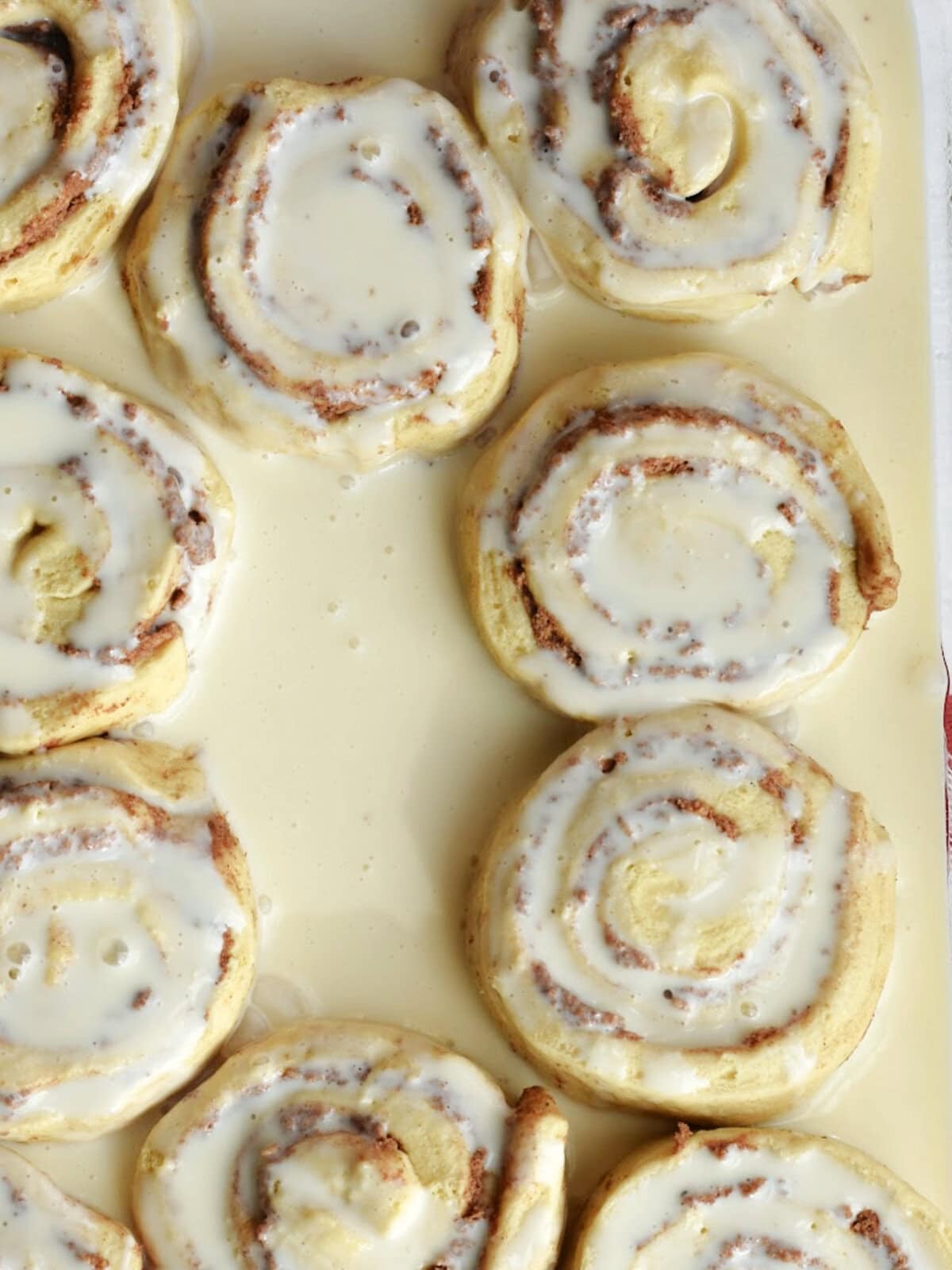 Uncooked cinnamon rolls in sweetened condensed milk creamer. 