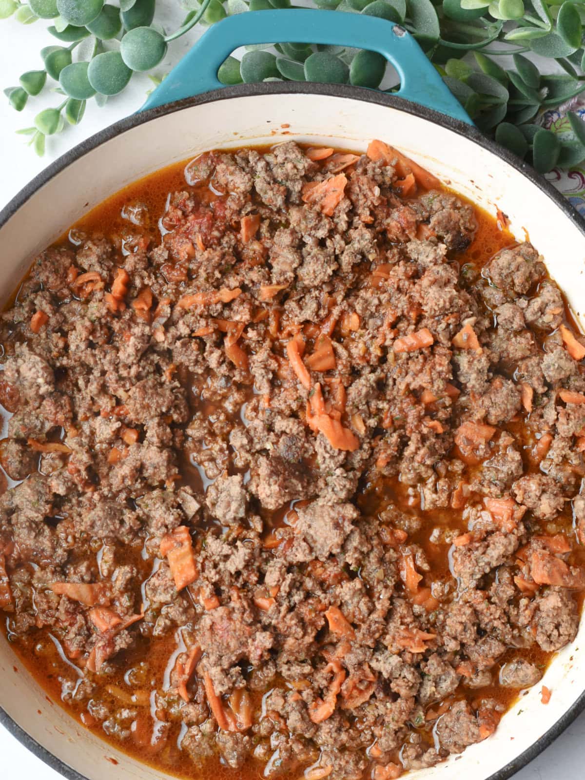 Deglazing the skillet with beef broth. 