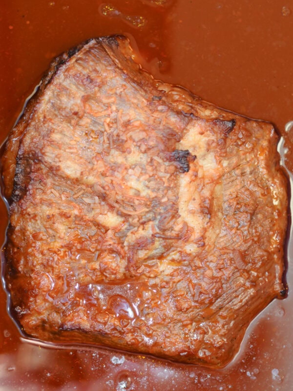 Fully cooked beef with a tomato based sauce. 