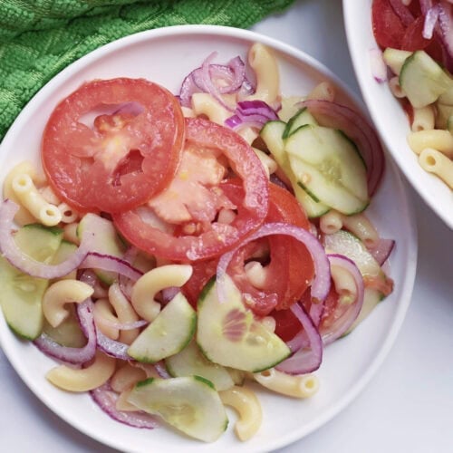 Cucumber Tomato Pasta Salad served at a summer party.