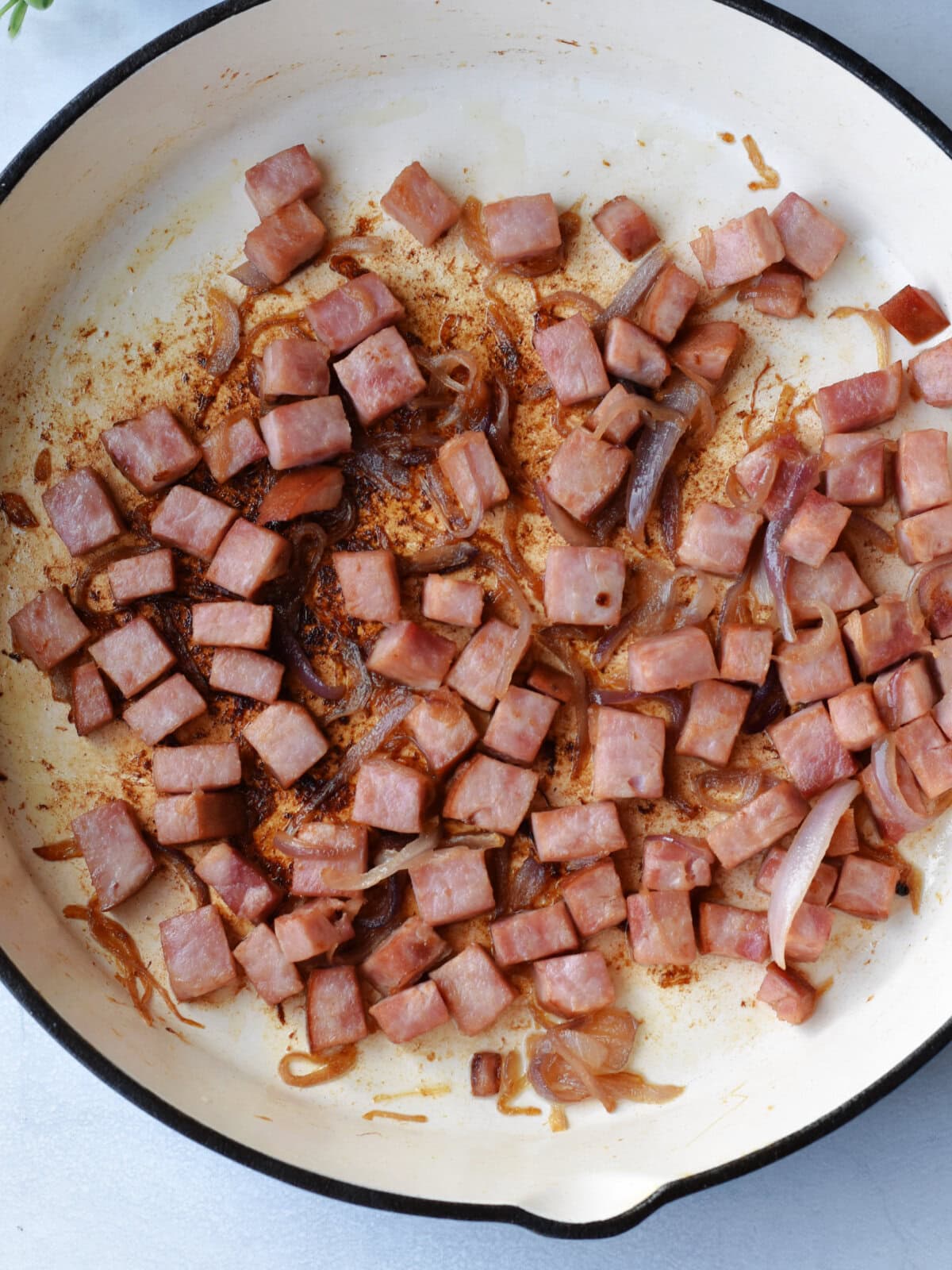 Ham-steak-recipe-frying Frying the ham steak in a skillet.