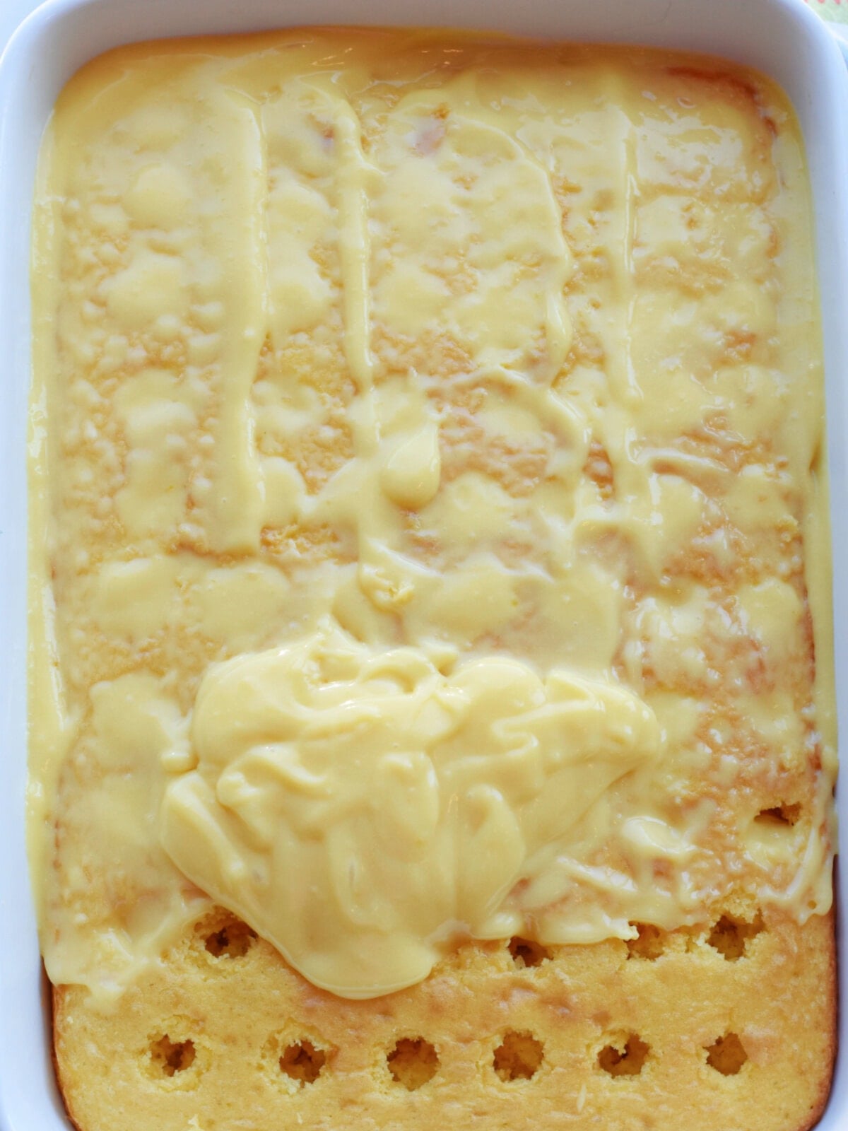 Lemon poke cake with pudding in the wholes. 