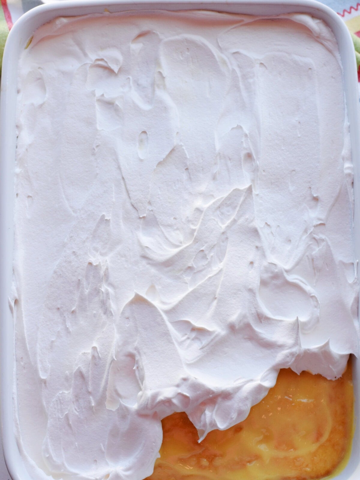 Whipped topping on a 9X13 dessert. 