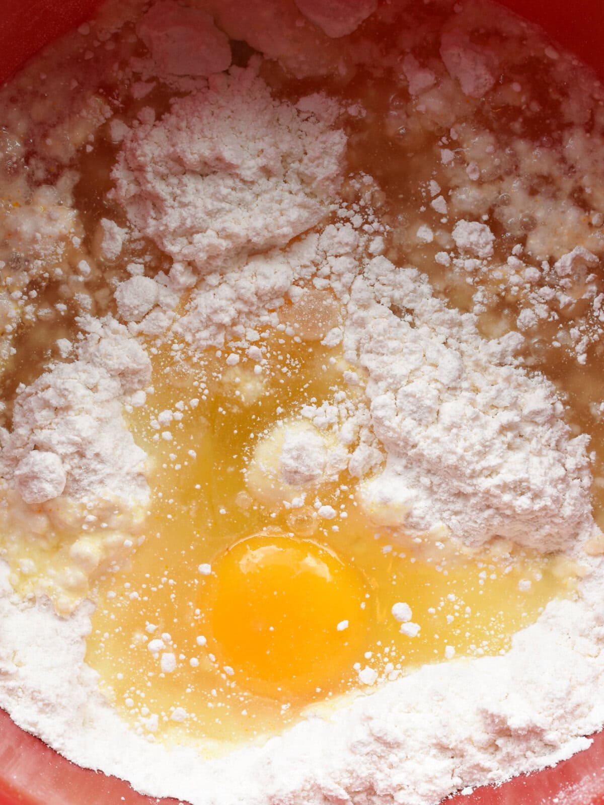 Box mix flour with an egg an doil in a mixing bowl. 