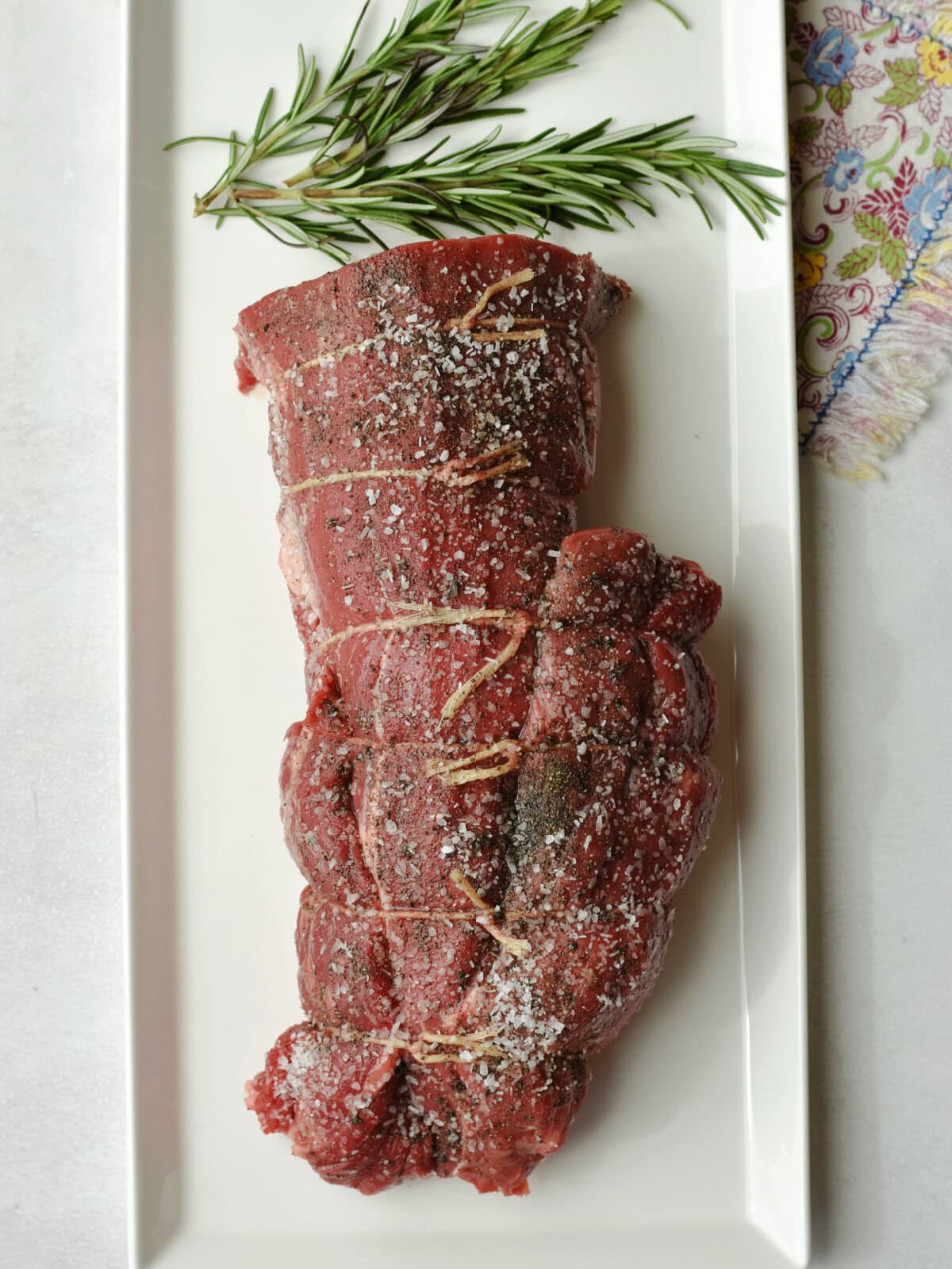 roasted-beef-tenderloin-resting Seasoned Roasted Beef Tenderloin resting on a counter before cooking.