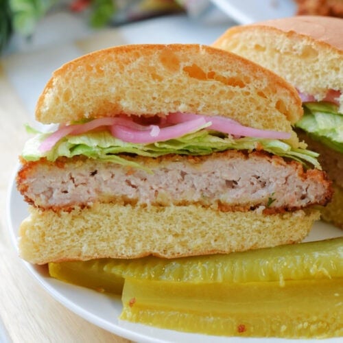 Pork Cutlet Sandwiches on a white plate.