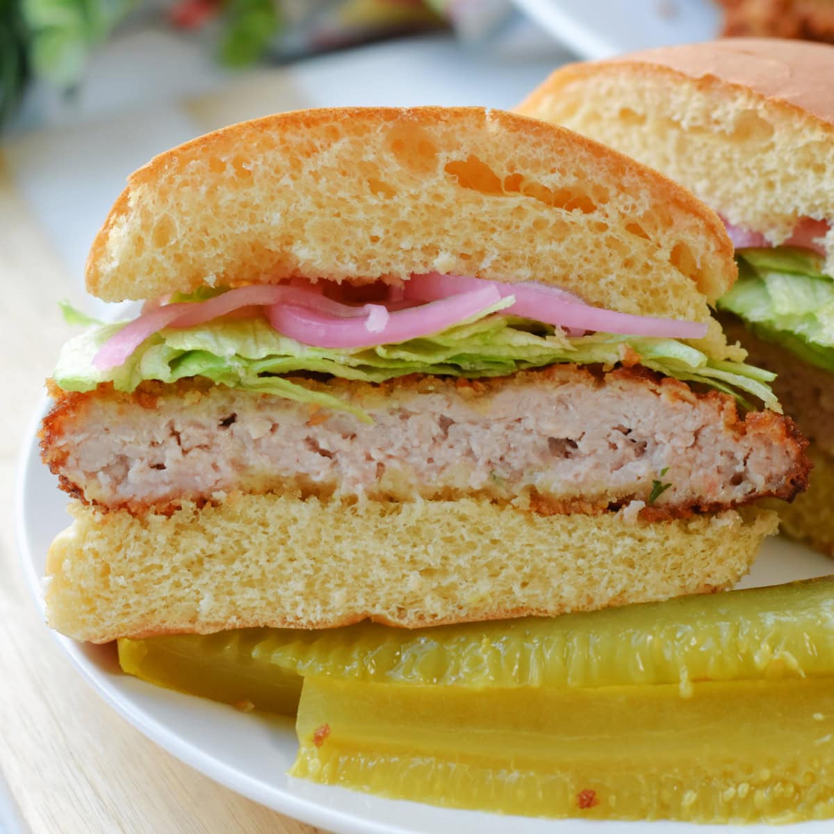 Pork Cutlet Sandwiches on a white plate.