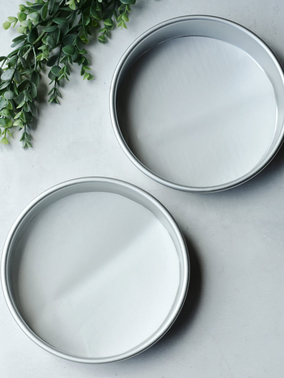 Two greased cake pans. 