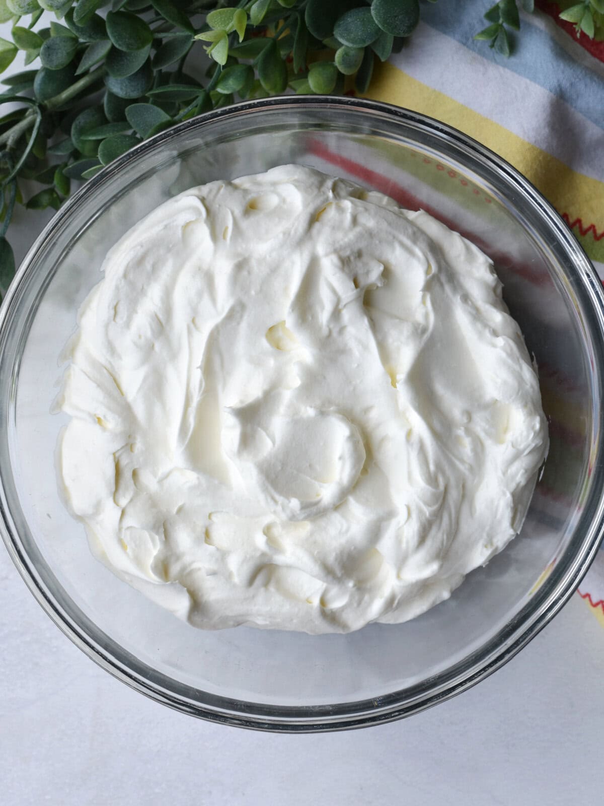 White frosting in a mixing bowl. 