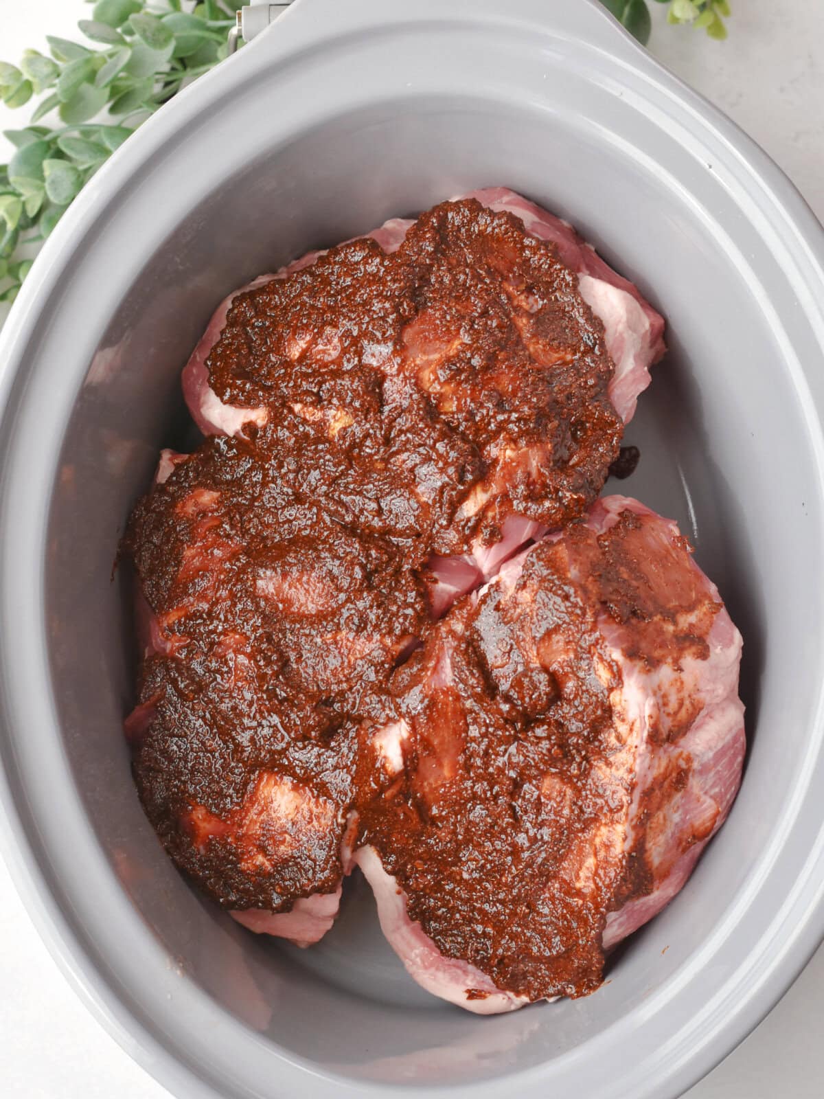 Butt pork with liquid seasoning on top. 