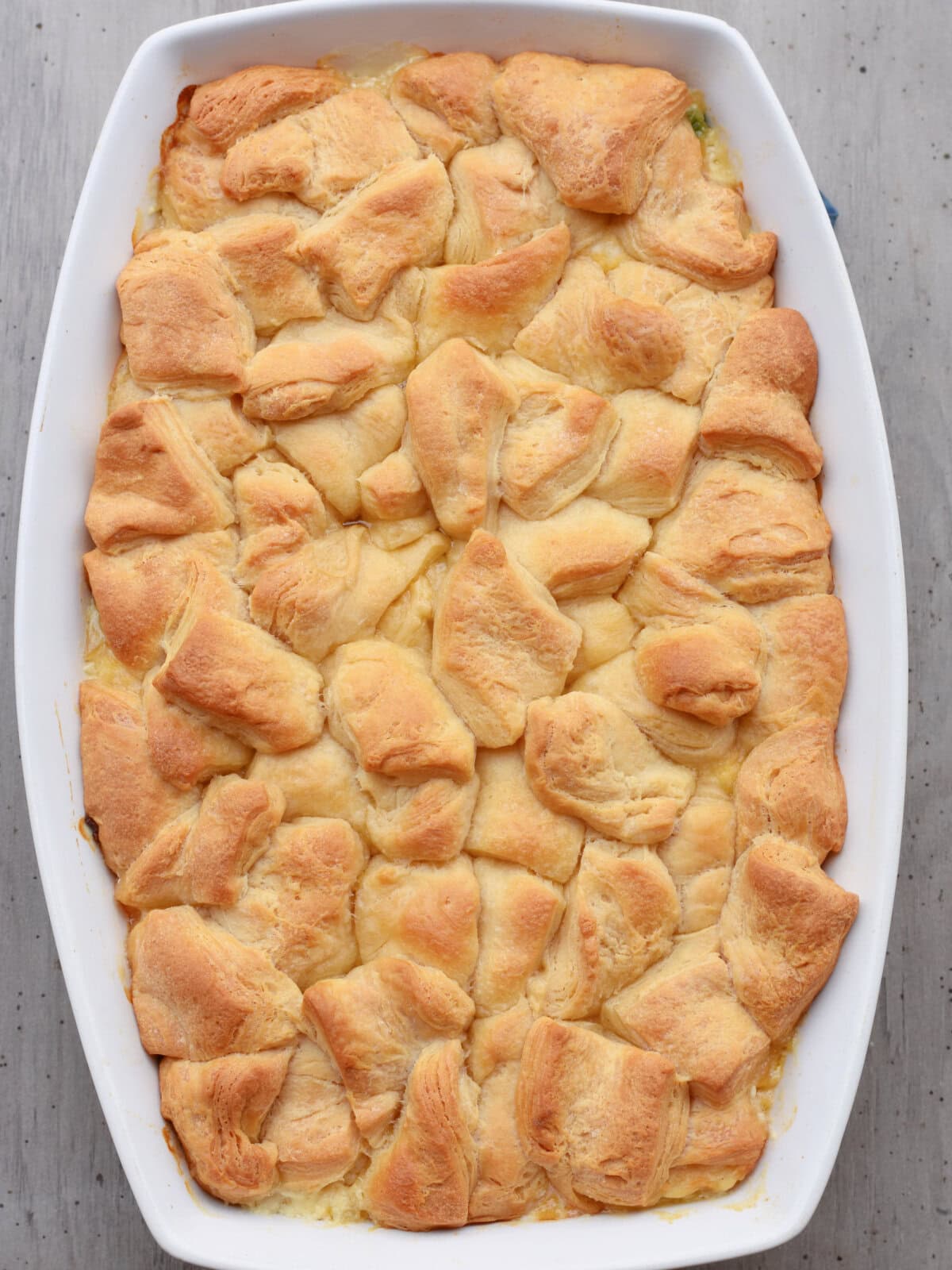 Golden brown biscuits on top of casserole filling. 