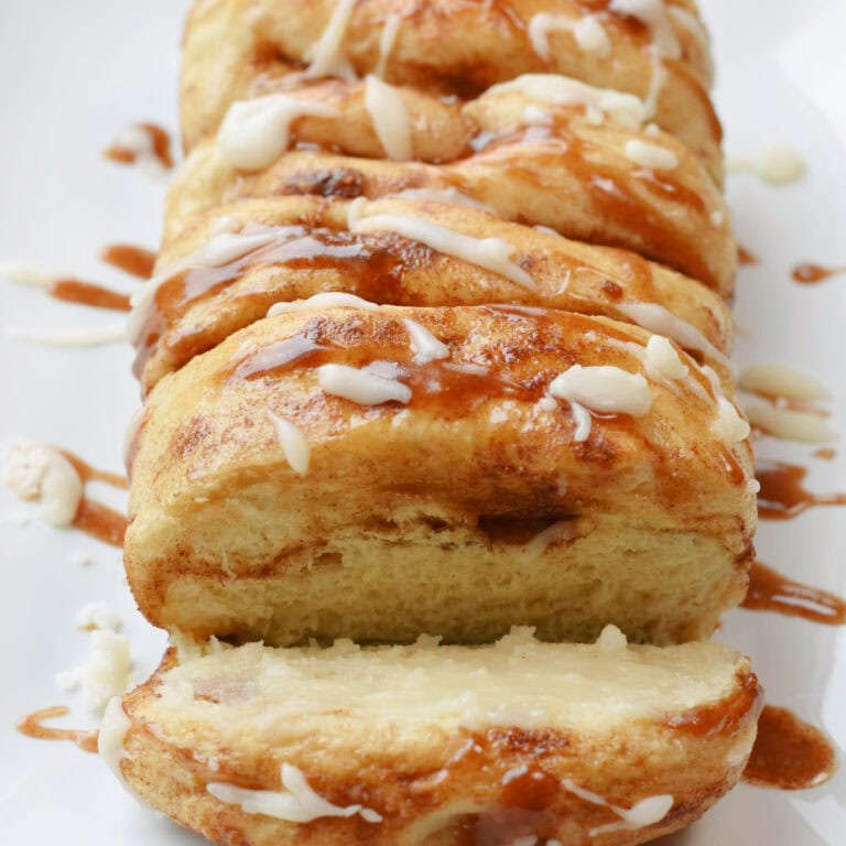 Cinnamon Pull Apart Bread with a slice taken out.