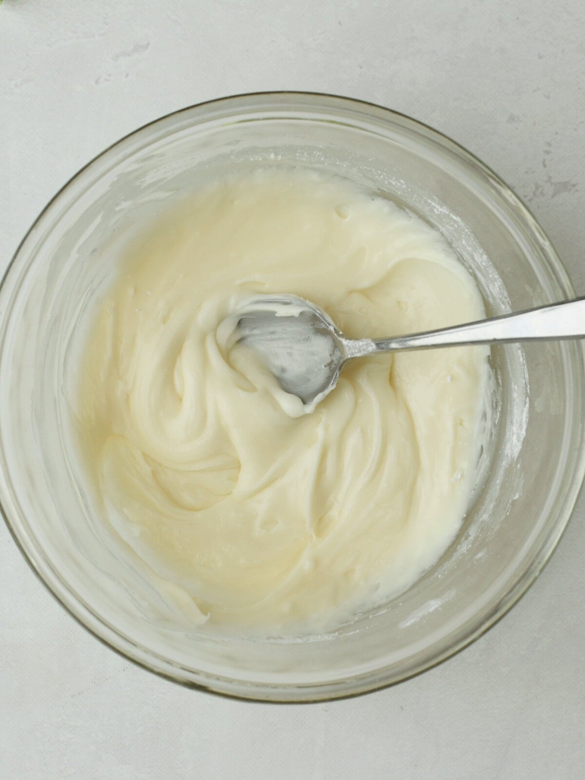cinnamon-pull-apart-bread-icing Sugar icing in a mixing bowl.