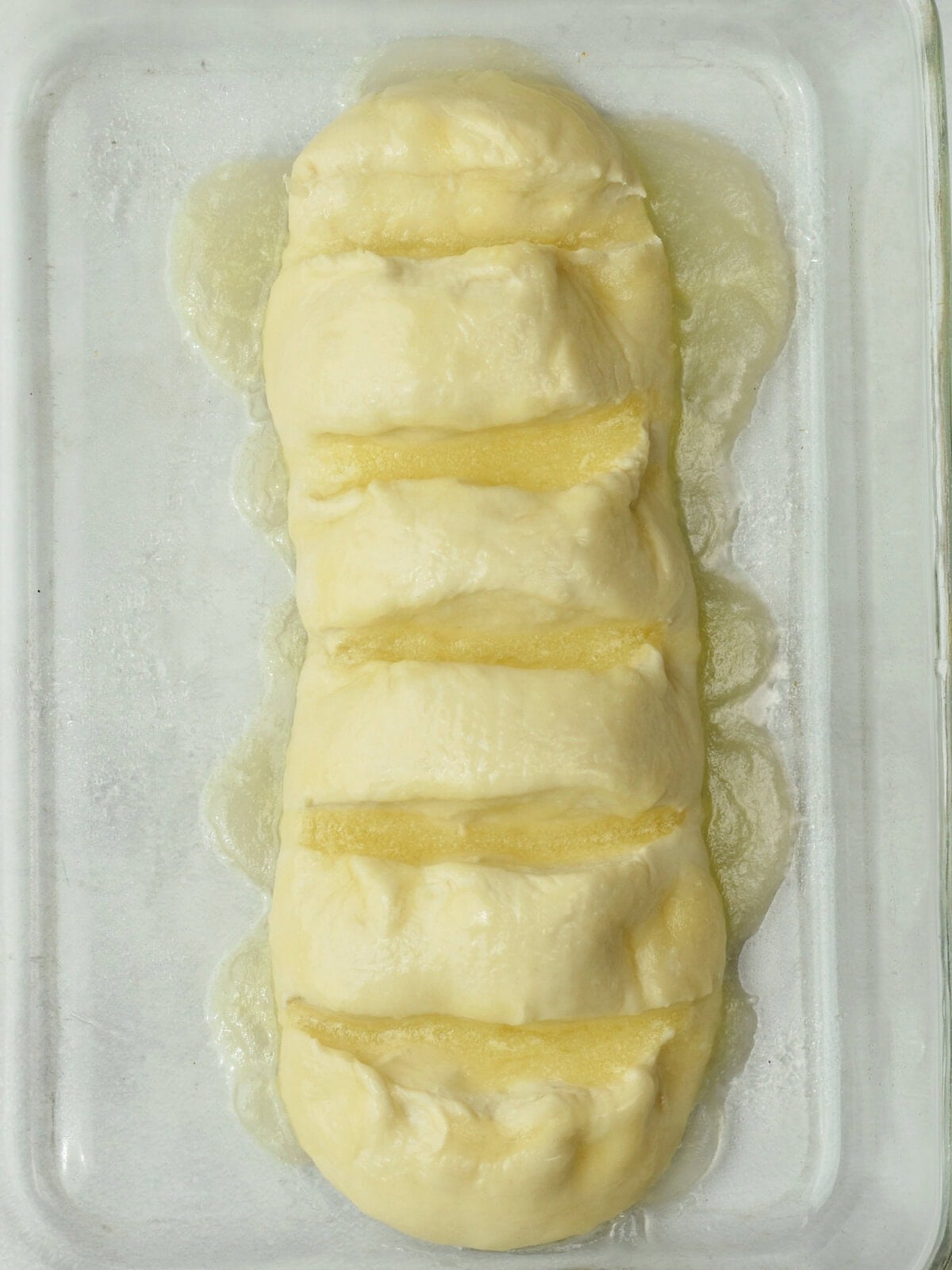 cinnamon-pull-apart-bread-buttered Rhodes bread dough with butter and corn syrup.