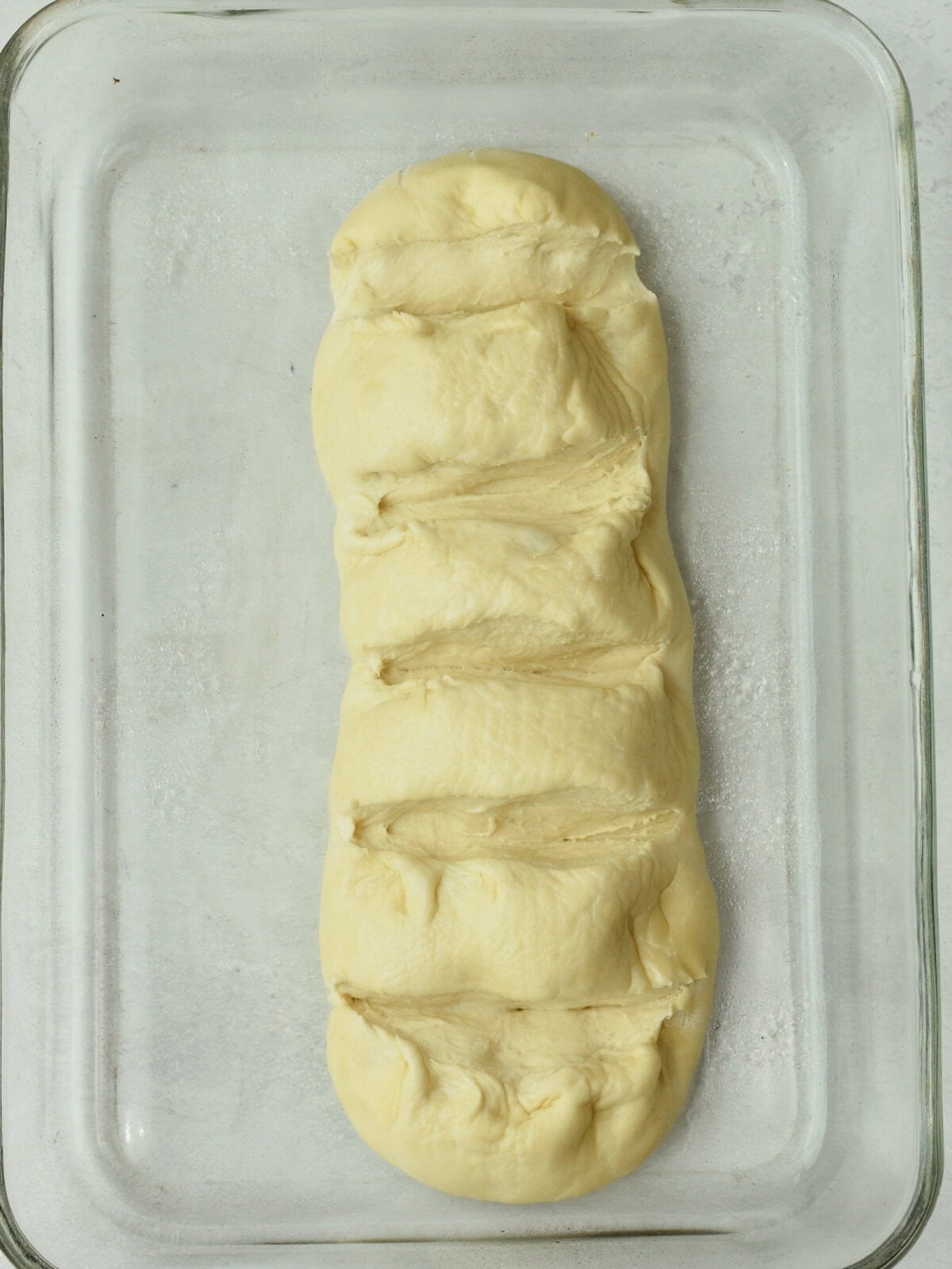 Cinnamon-pull-apart-bread-uncooked Bread dough in a cooking dish.