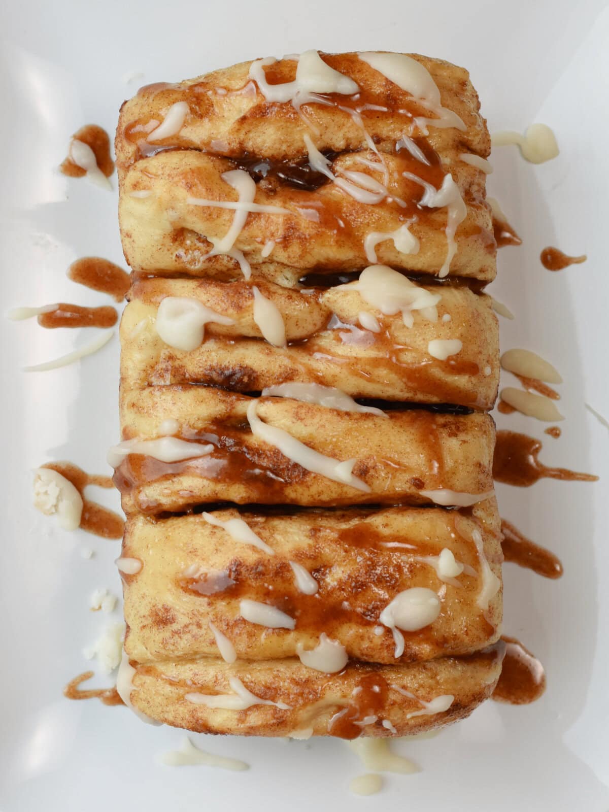 cinnamon-pull-apart-bread-iced Cinnamon Pull Apart Bread with sugar icing and cinnamon sugar icing.