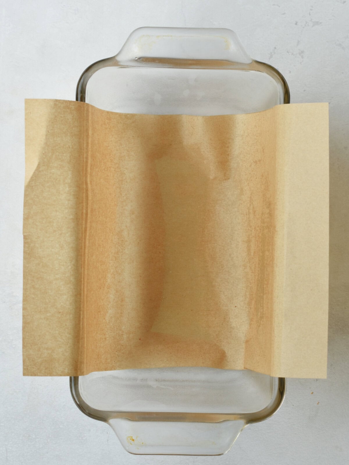 cinnamon-pull-apart-bread-parchment Greased loaf pan with parchment paper.