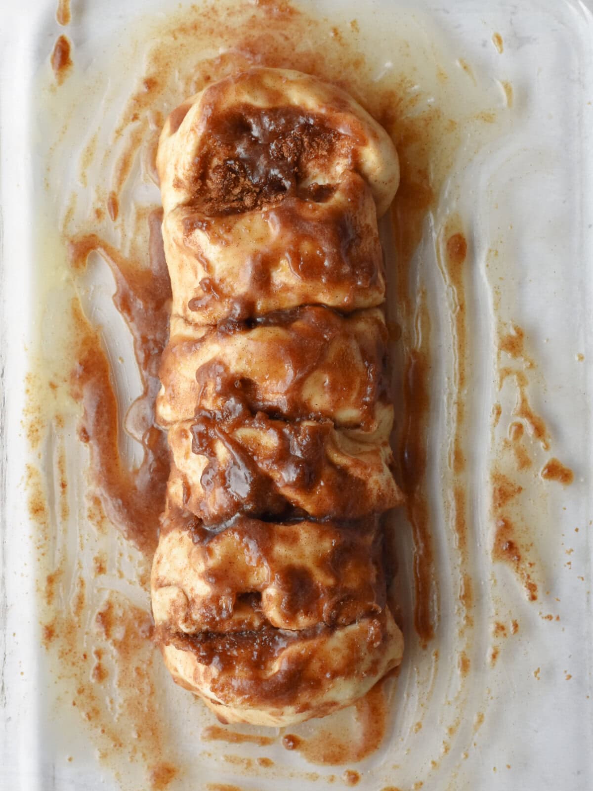 cinnamon-pull-apart-bread-coated Rhodes bread dough with cinnamon and sugar over the loaf.