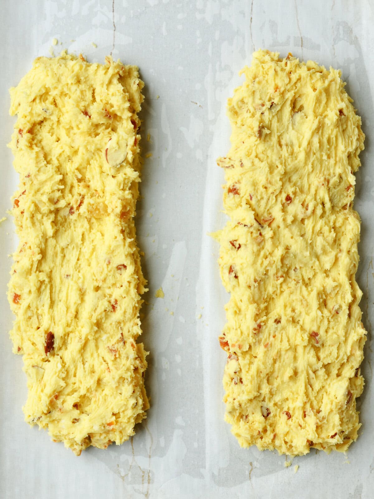 Divided dough into 3 inch wide by 11 inches long ready for baking. 