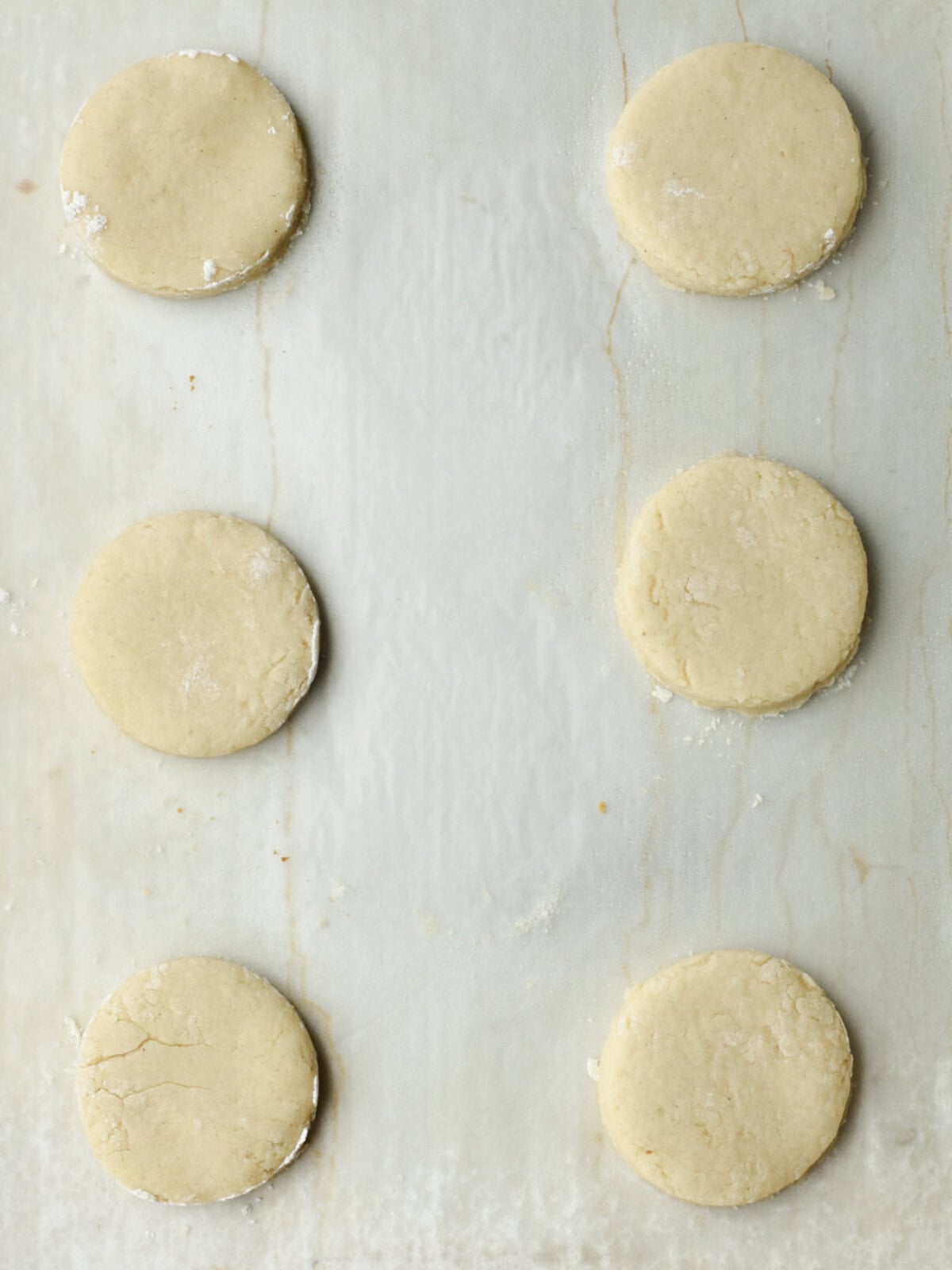 Dough on a greased cookie sheet to rise, ready to bake. 