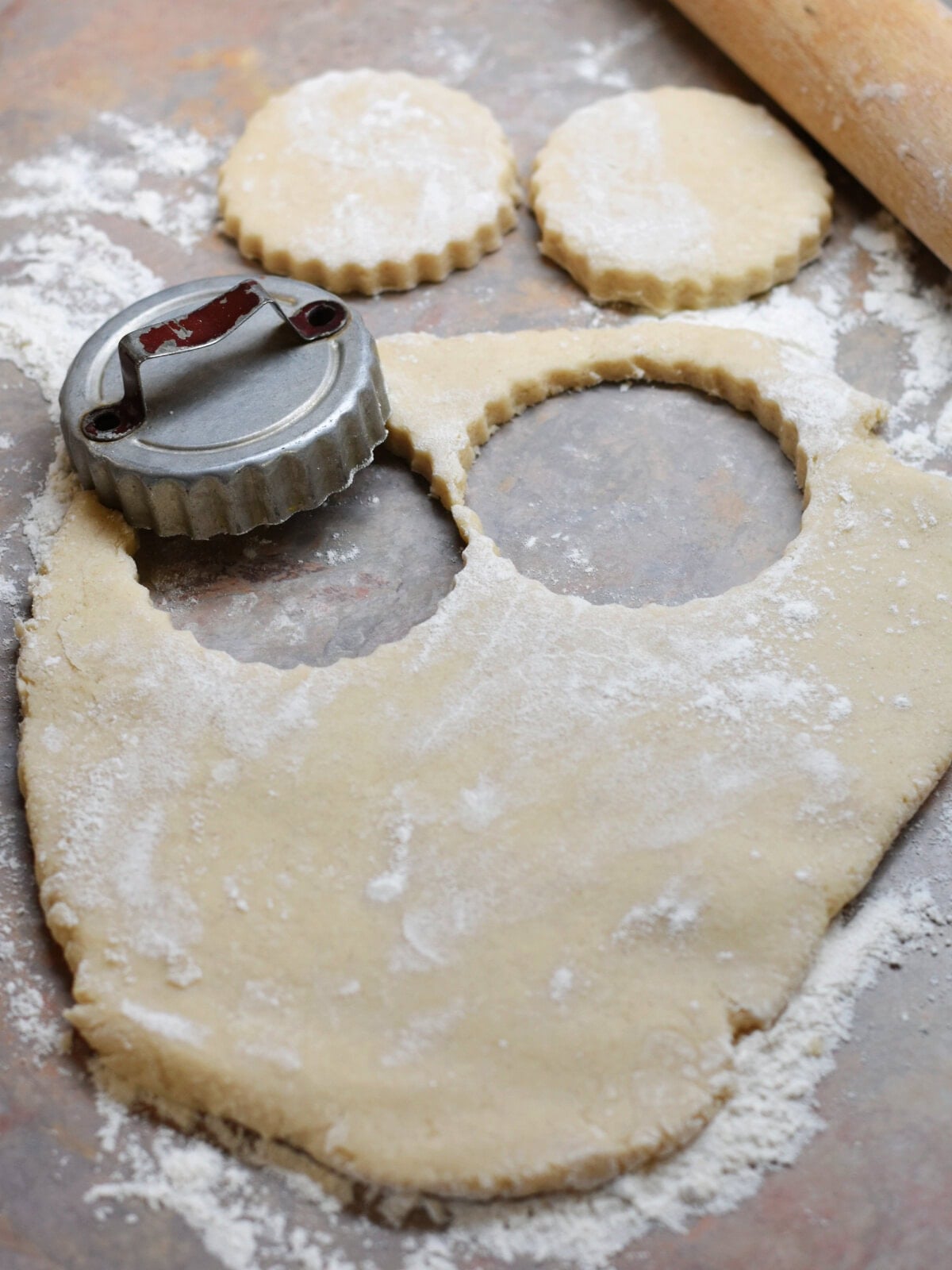 Cutting out dough to make cookies. 