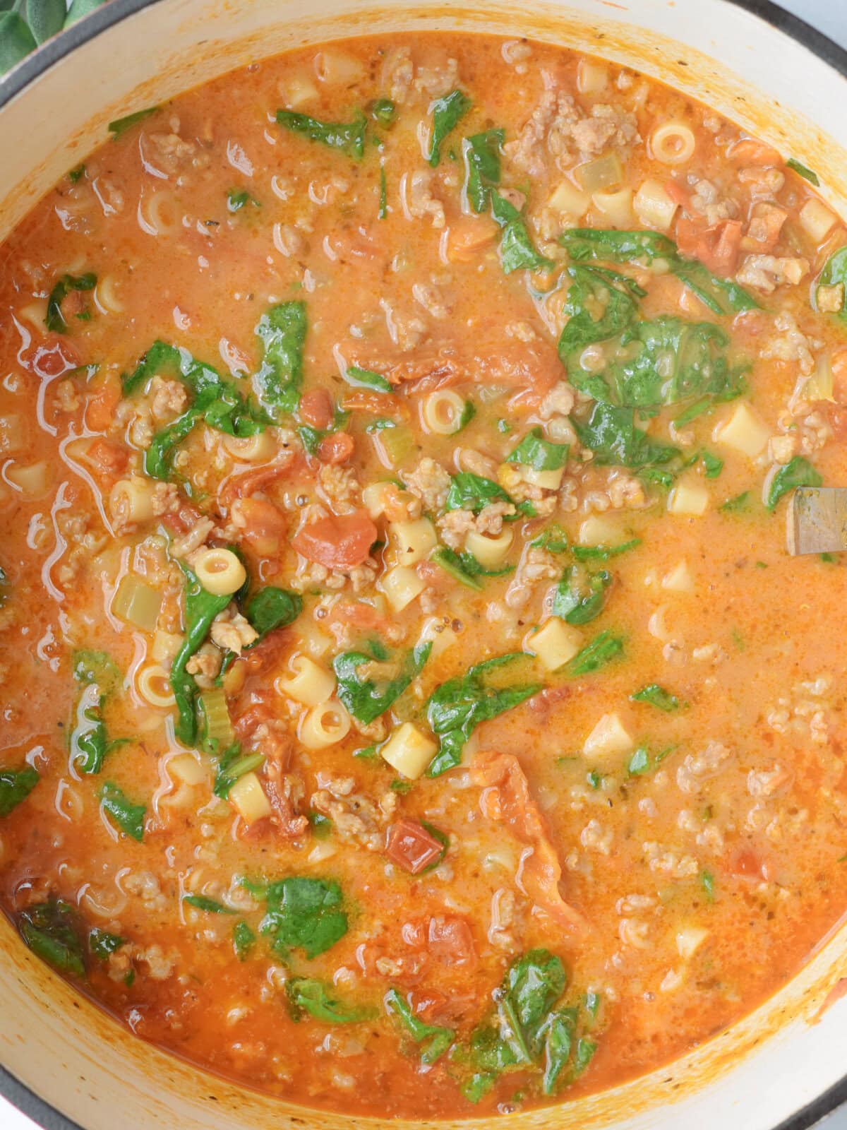 Simmering soup with sausage. 