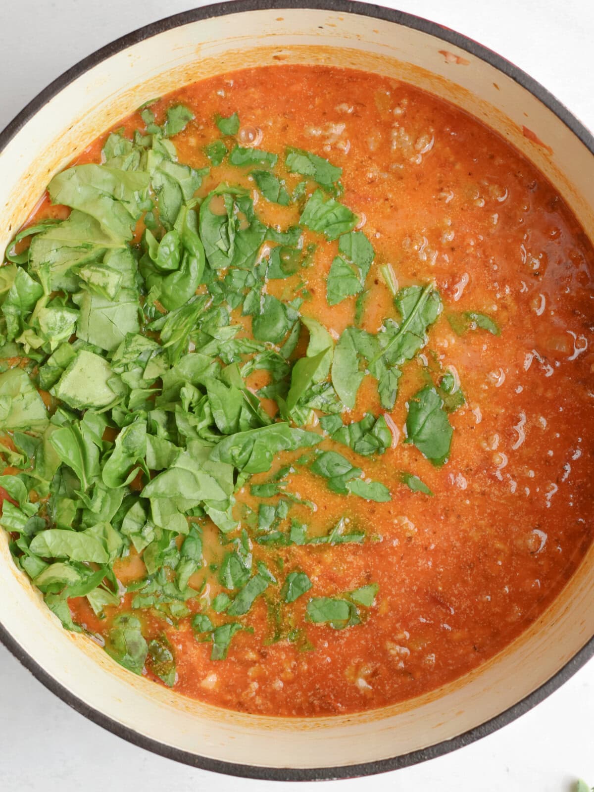 Spinach in a meat-based soup. 