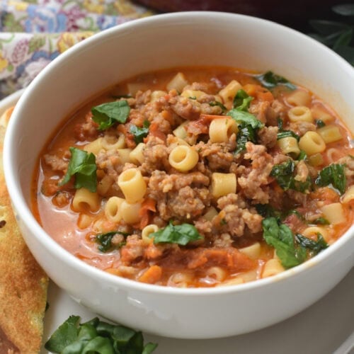 Creamy Italian Sausage Soup in a white bowl.